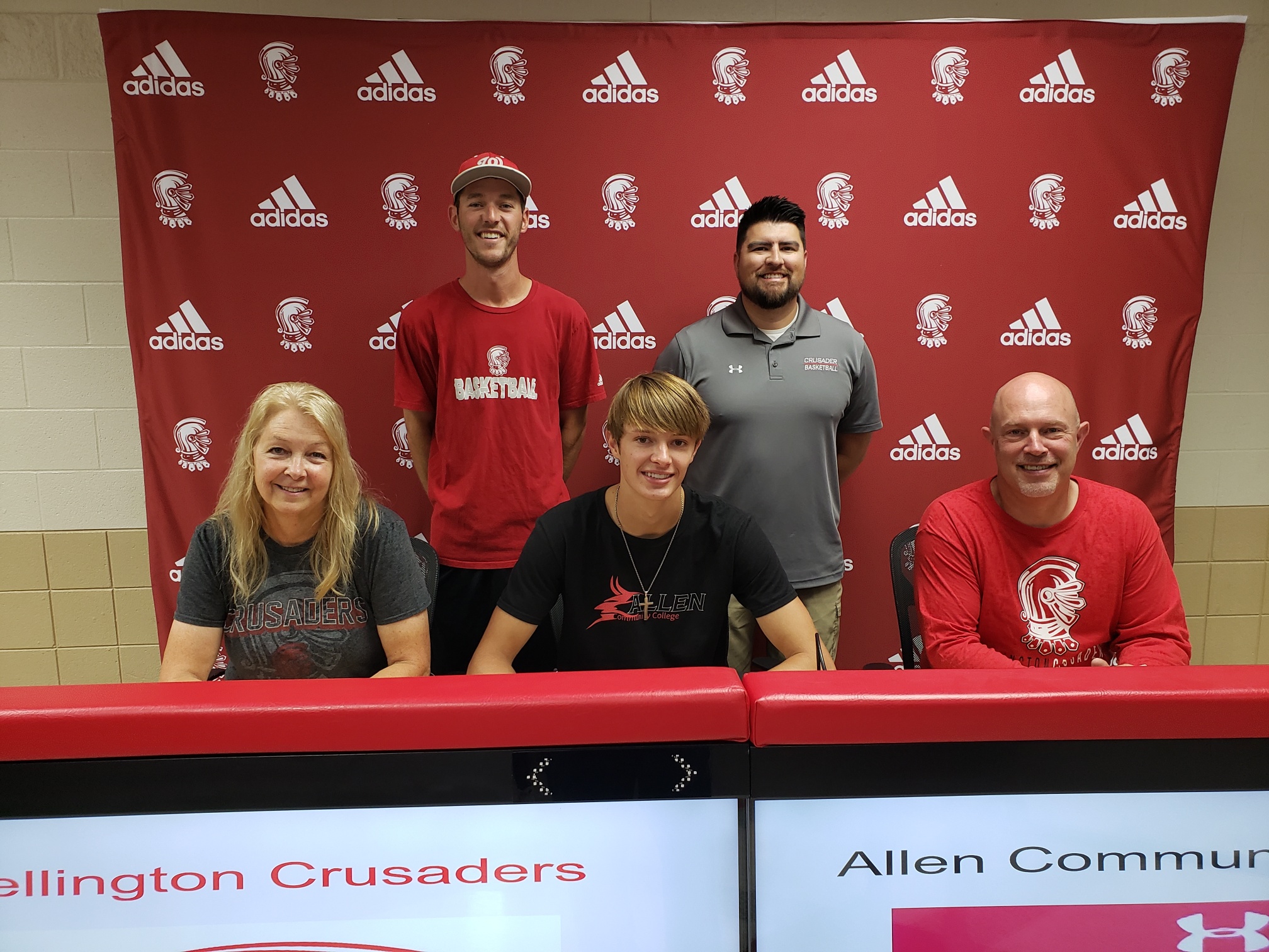 Tanner Meyer signing at WHS to attend Allen County to play basketball